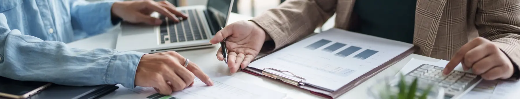 Startup founders discussing tax planning and investment strategy with financial advisor
